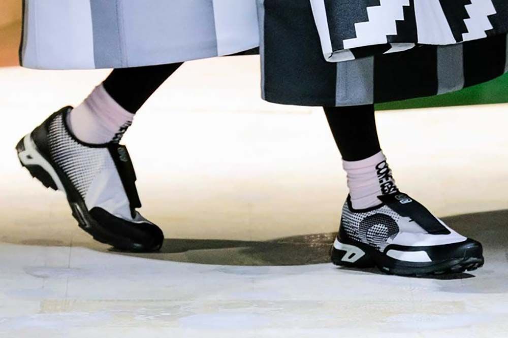 Salomon collaborates with Comme Des Garçons for SS22 fashion show