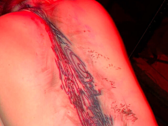 What is Billie Eilish’s back tattoo?