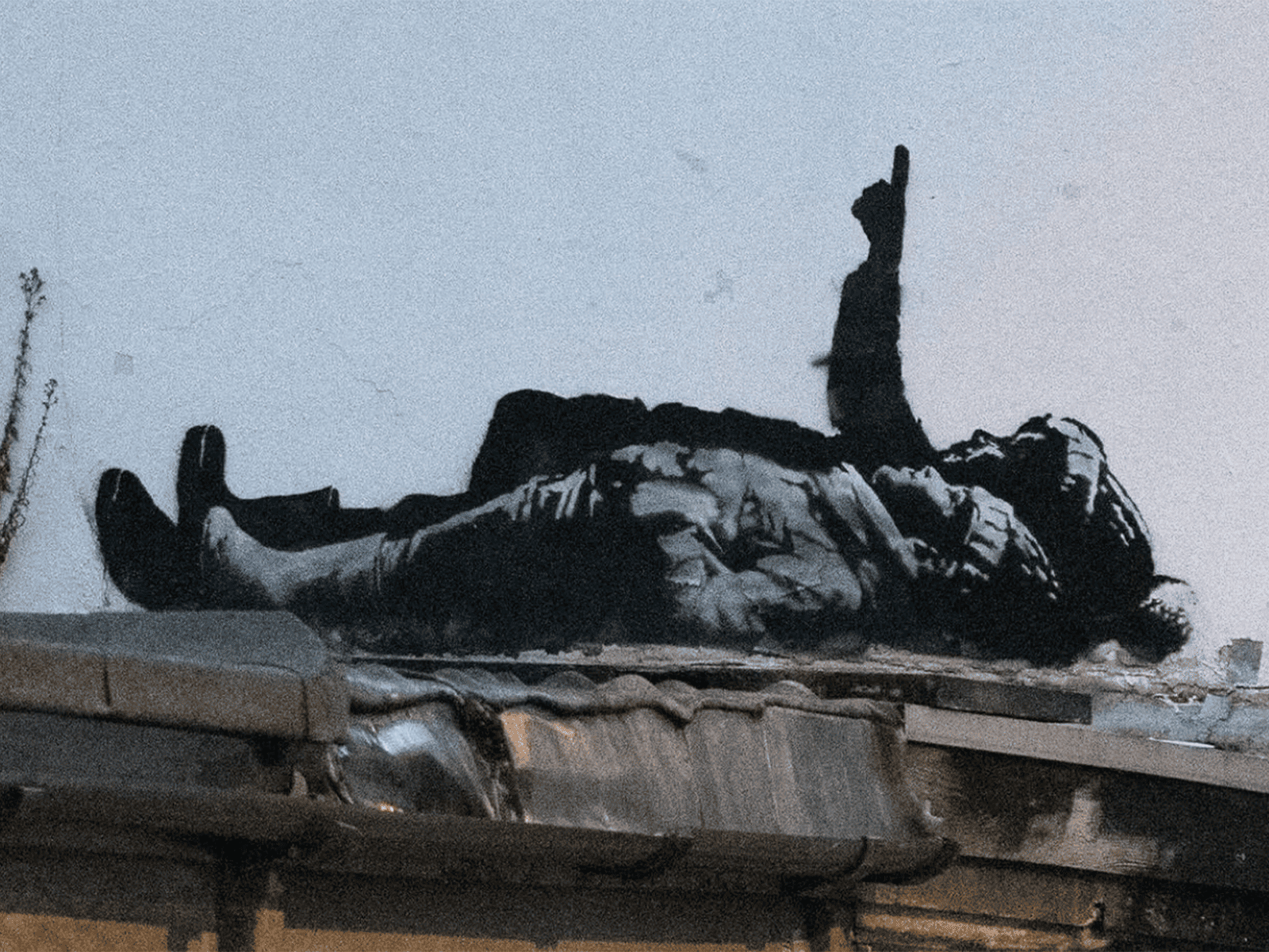 Banksy unveils twin murals across London ahead of Christmas